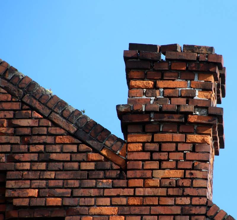 Damaged chimney on an Imperial Beach home showing cracks and missing mortar